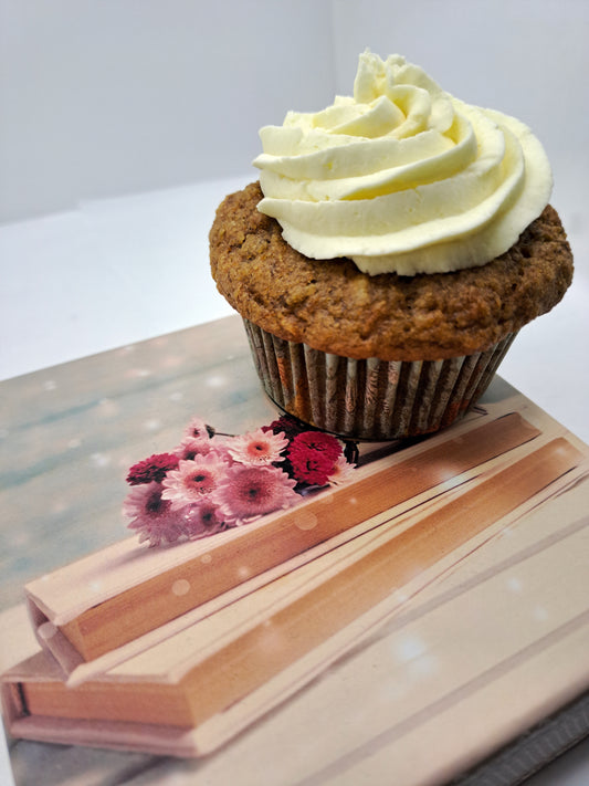 Vegan carrot muffin with vanilla frosting