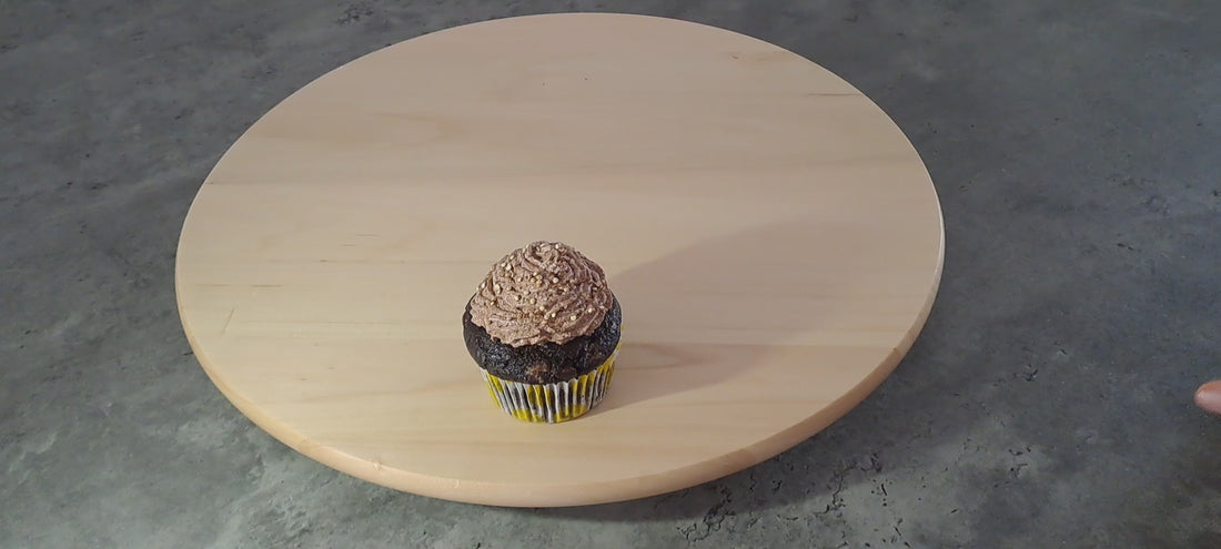 A short video of vegan chocolate muffins being put on a wooden plate 